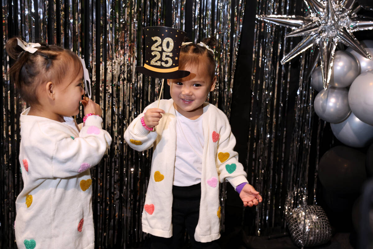 Twins Olivia, left, and Chloe Ramirez, 3, pose during “Noon Year’s Eve” ce ...