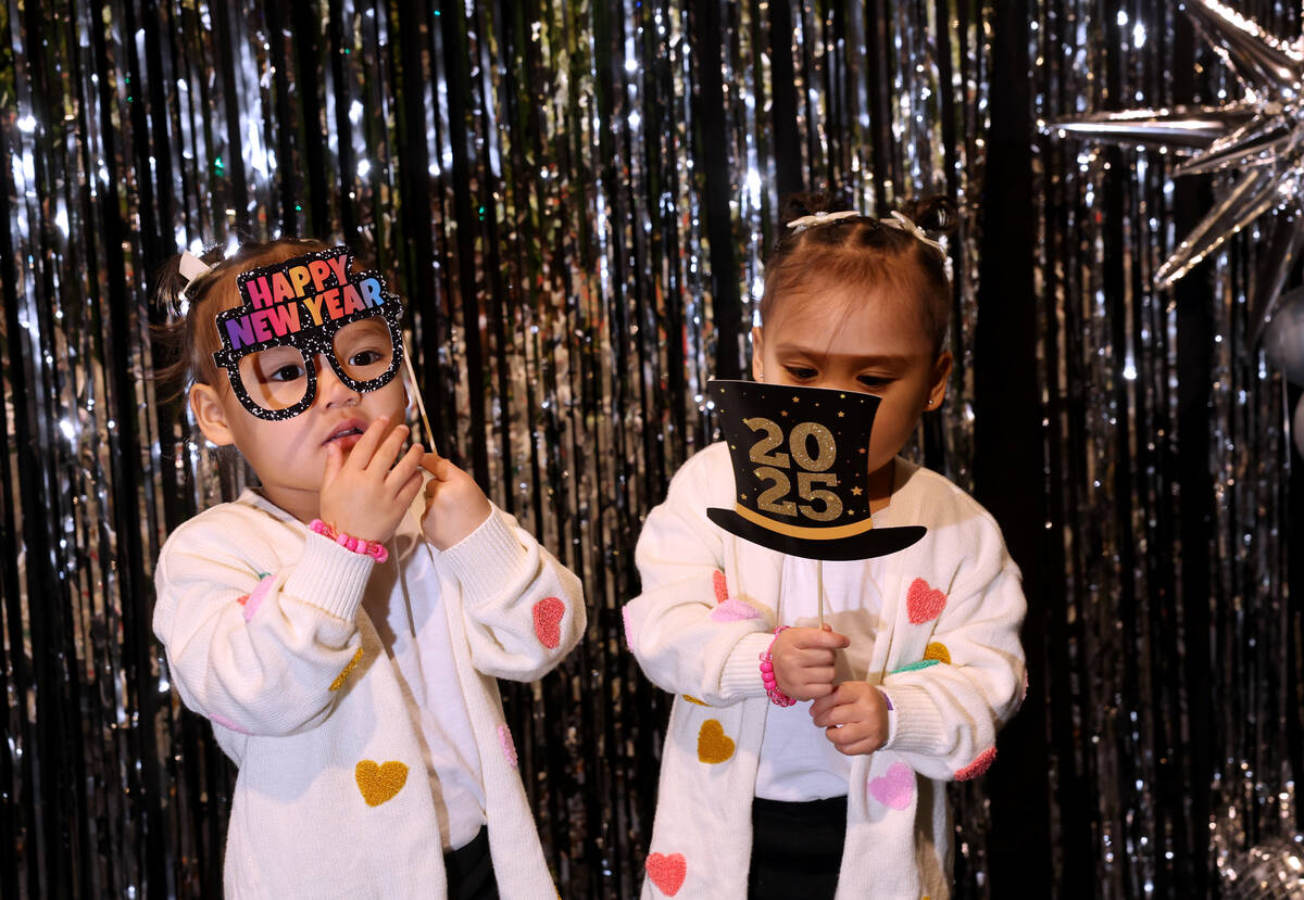 Twins Olivia, left, and Chloe Ramirez, 3, pose during “Noon Year’s Eve” ce ...