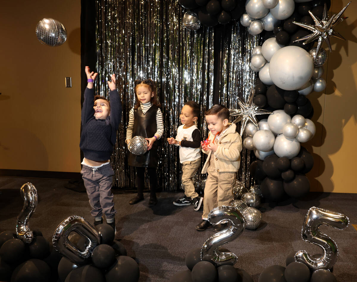 The Garza family, from left, Sebastian, 2, Charlotte, 6, Jay, 4, and Elliott, 4, pose during &# ...