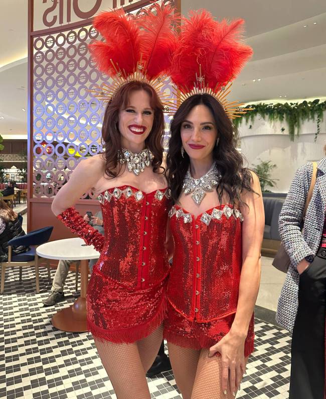 Tera Perez and Sara Crossanwait in line at Capons in the Fountainebleau food court on December ...