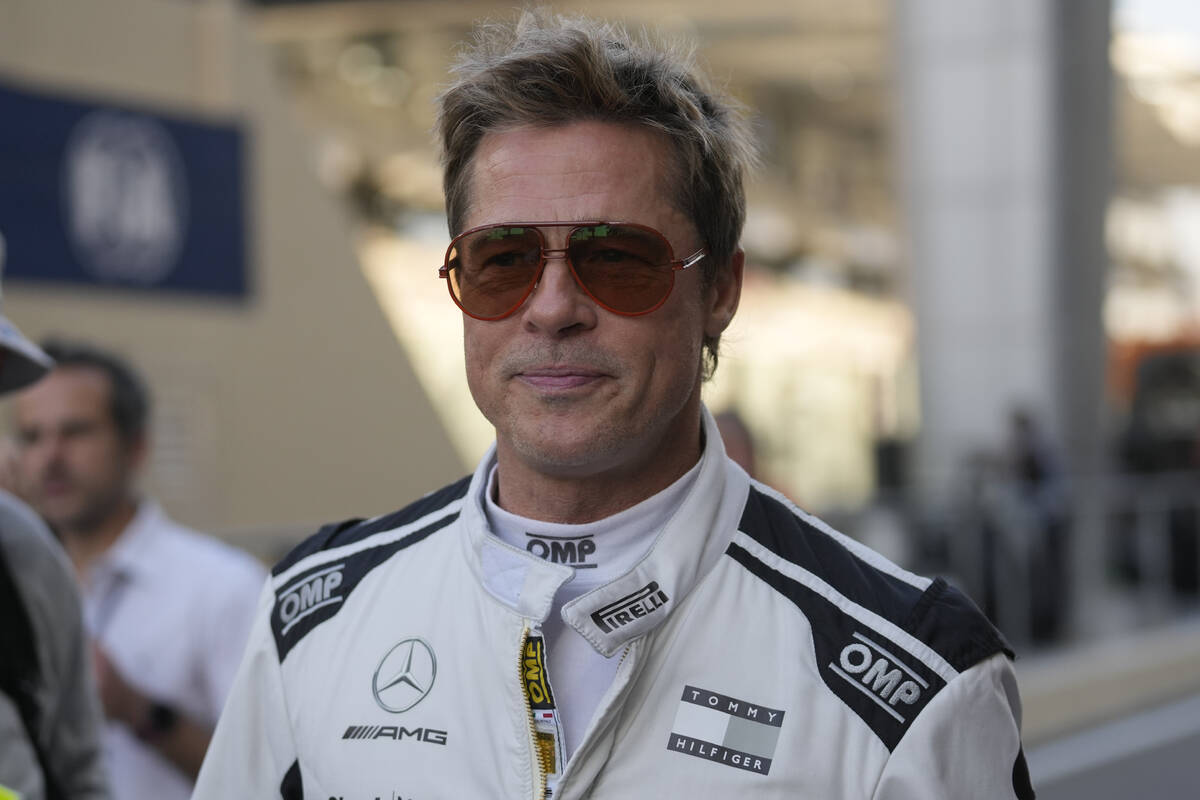 American actor Brad Pitt walks in the pit lane before the Formula One Abu Dhabi Grand Prix at t ...