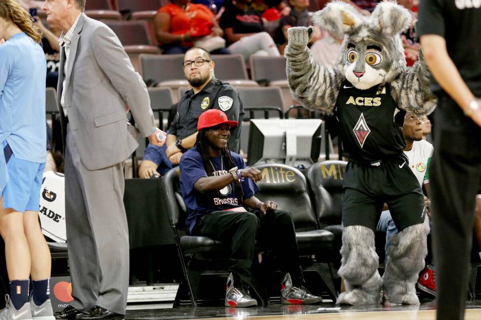 Flavor Flav dances with mascot Bucket$ at the final game of the season for Las Vegas Aces at th ...