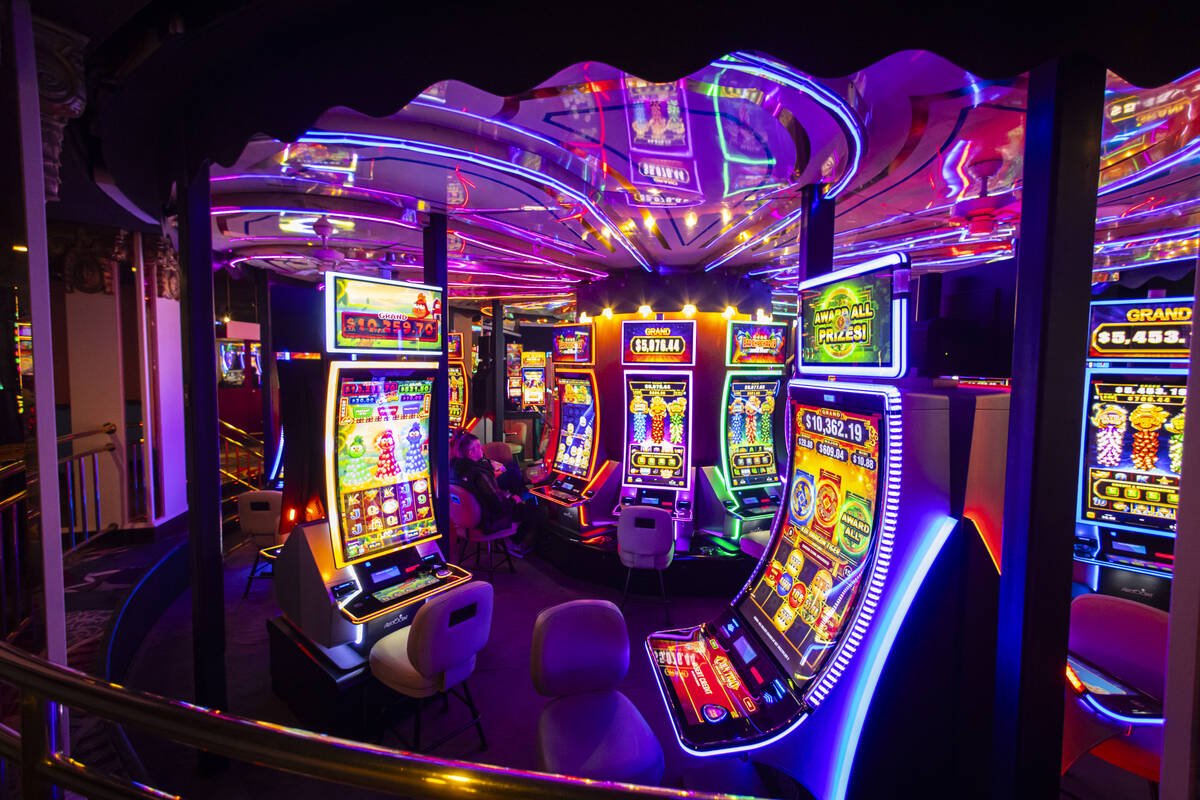 People play on a rotating floor of slot machines at Circus Circus on Wednesday, Dec. 11, 2024, ...