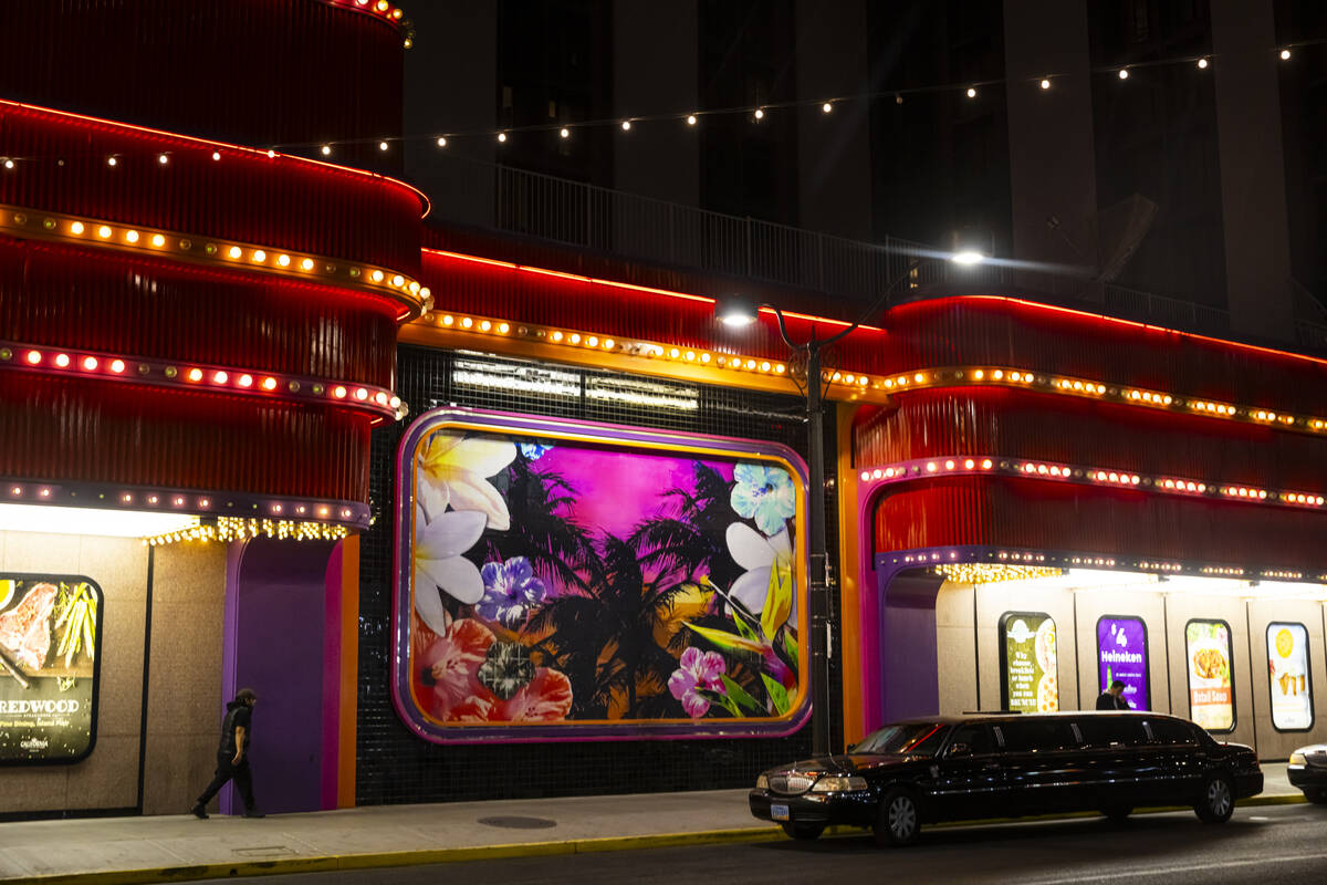 A limo is seen parked next to a tropical mural outside of the California Hotel on Wednesday, De ...