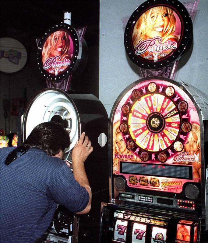 Technician Mike Arvizu works on setting up a Ballys Pamela Anderson Playboy slot machine. (Las ...