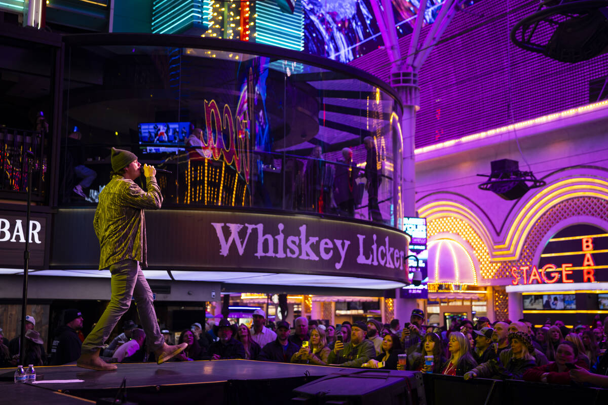 Dylan Marlowe performs at the Fremont Street Experience during the New Year’s Eve celebr ...