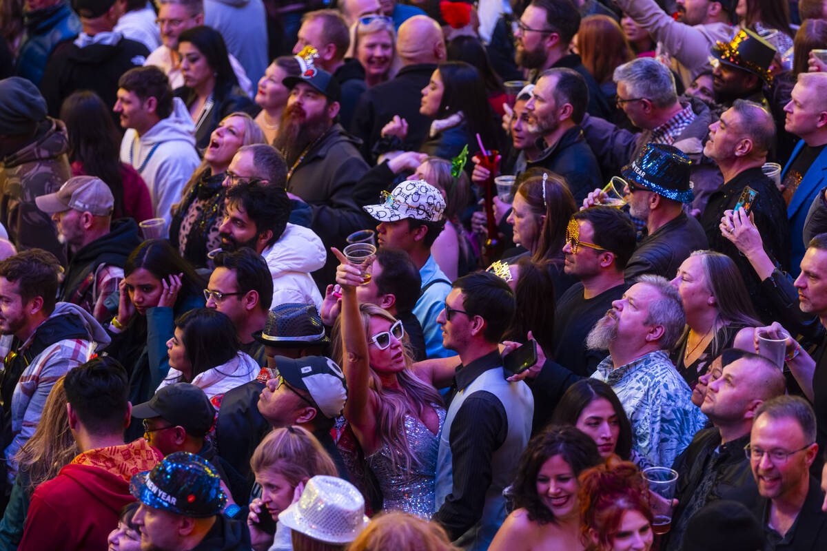 People celebrate the New Year while celebrating at the Fremont Street Experience Wednesday, Jan ...