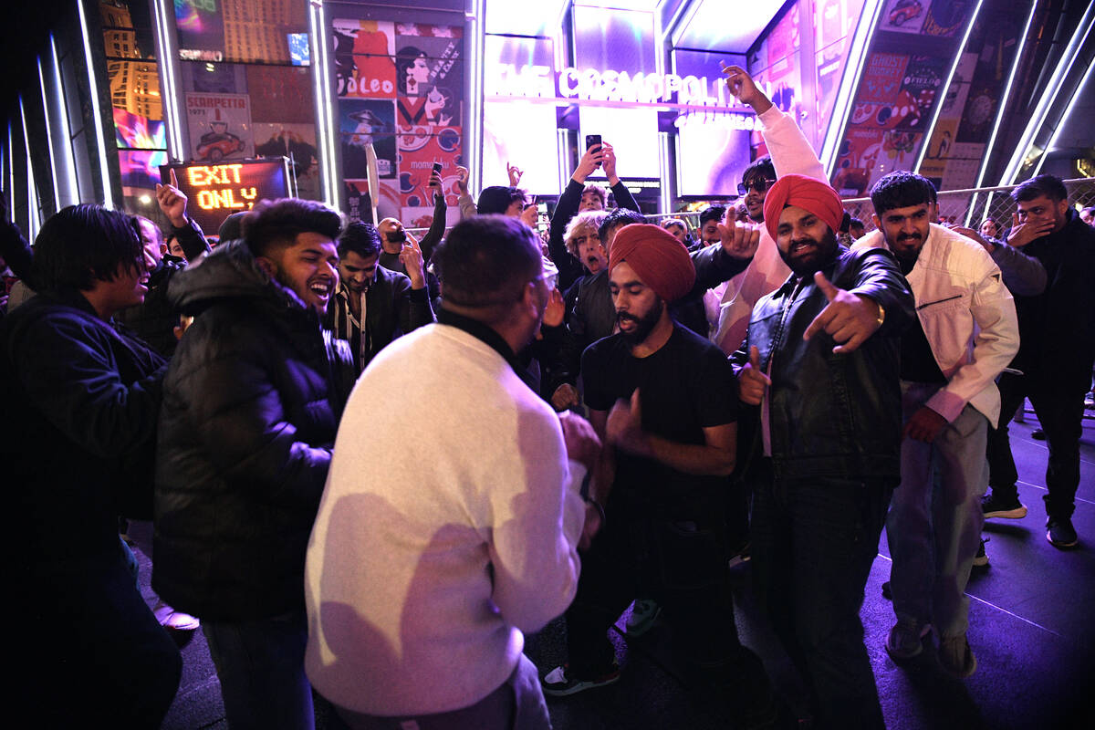 A group of men have an impromptu dance on the Strip Tuesday, December 31, 2024, in Las Vegas. ( ...