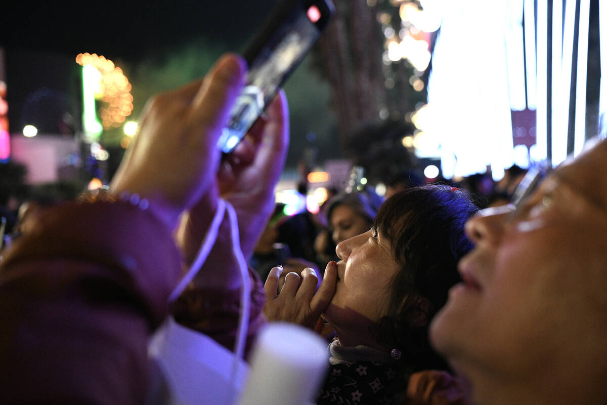 Revelers watch New Year’s Eve fireworks on the Strip in Las Vegas Wednesday, January 1, ...