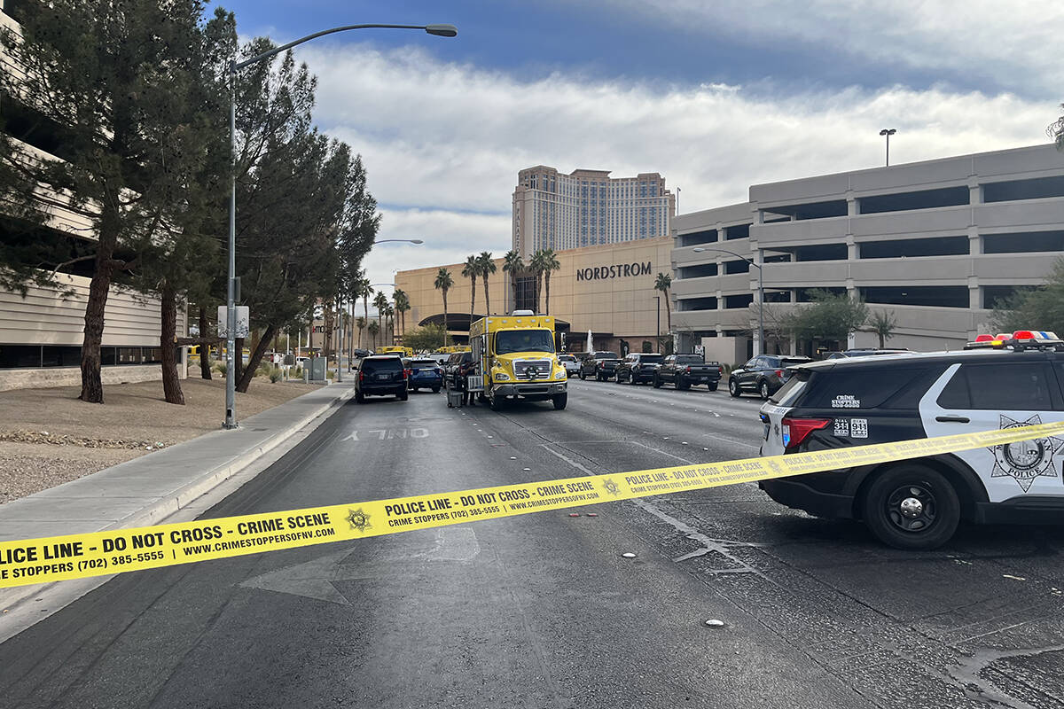 Police enforce road closures at Desert Inn Road and Sammy Davis Jr. Drive after a vehicle fire ...