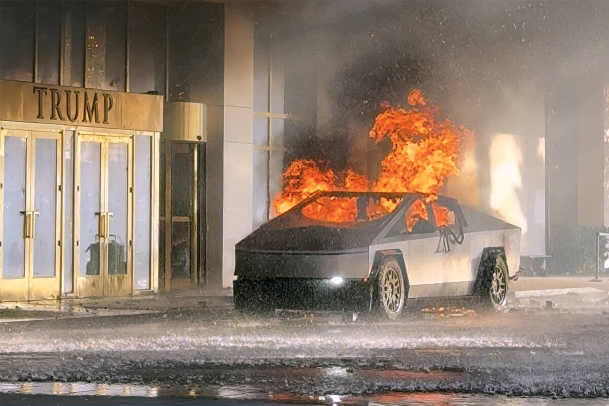 A screenshot shows a Tesla Cybertruck on fire outside the entrance of Trump International Hotel ...