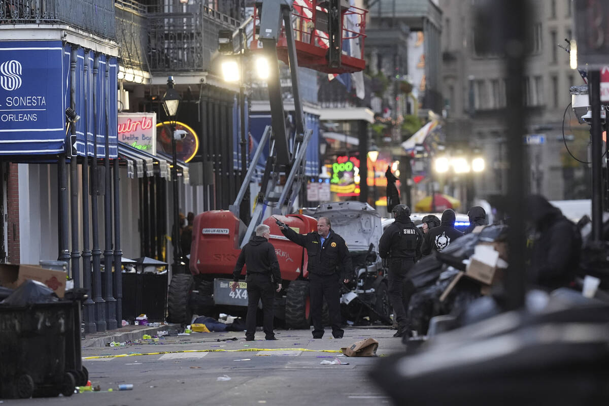 EDS NOTE: GRAPHIC CONTENT - Emergency personnel work the scene on Bourbon Street after a vehicl ...