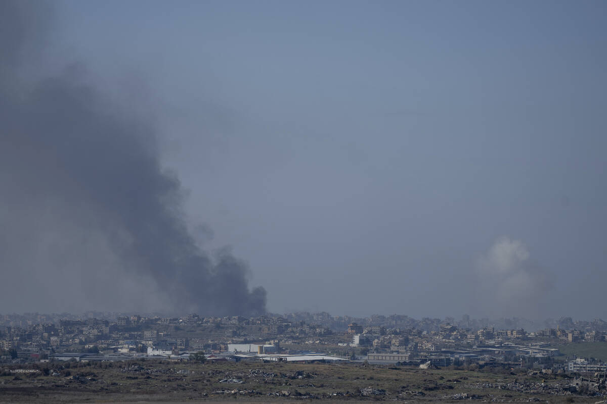 Smoke rises following an explosion in the Gaza Strip as seen from southern Israel, Wednesday, J ...