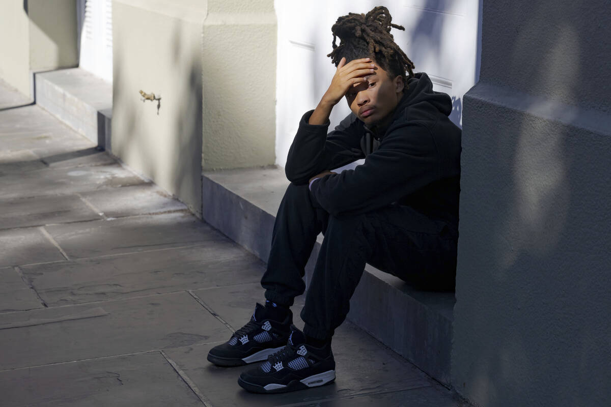 Trevant Hayes, 20, sits in the French Quarter after the death of his friend, Nikyra Dedeaux, 18 ...