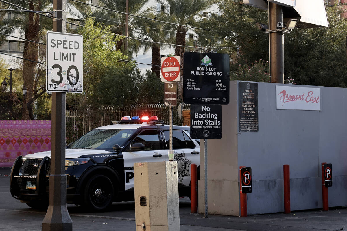 A Las Vegas police vehicle is seen with flashing lights at Las Vegas Boulevard near East Fremon ...