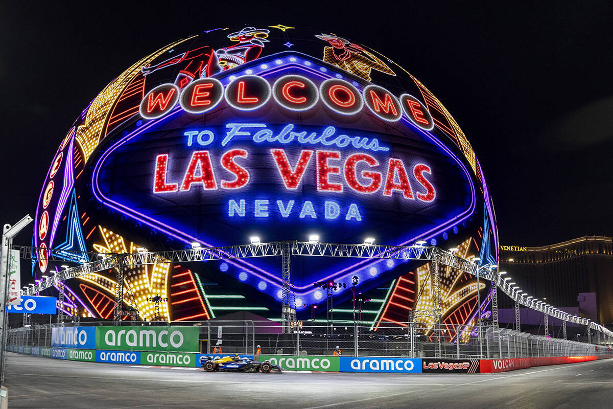 A race car navigates around the Sphere during the qualifying round for the Formula 1 Las Vegas ...