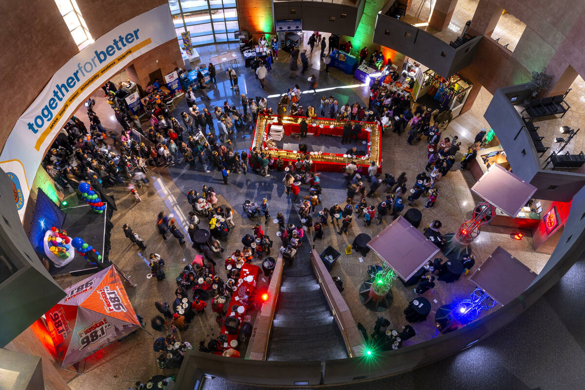 People wait in line to get a slice of the Rosca de Reyes (King’s Cake) and hopefully find a h ...