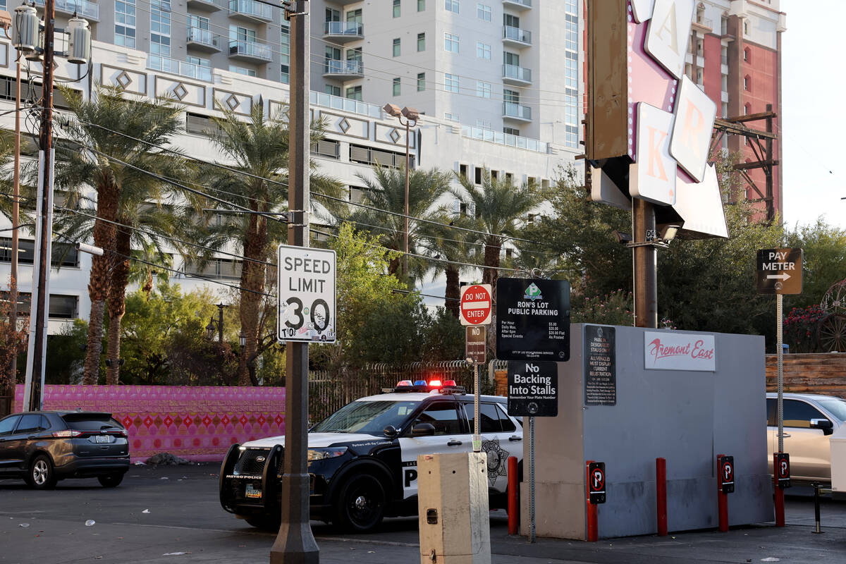 A Las Vegas police vehicle is seen with flashing lights at Las Vegas Boulevard near East Fremon ...