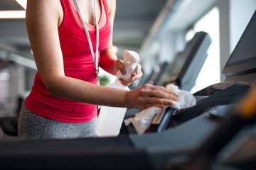 Avoid touching gym surfaces that haven't been properly cleaned. (Getty Images)