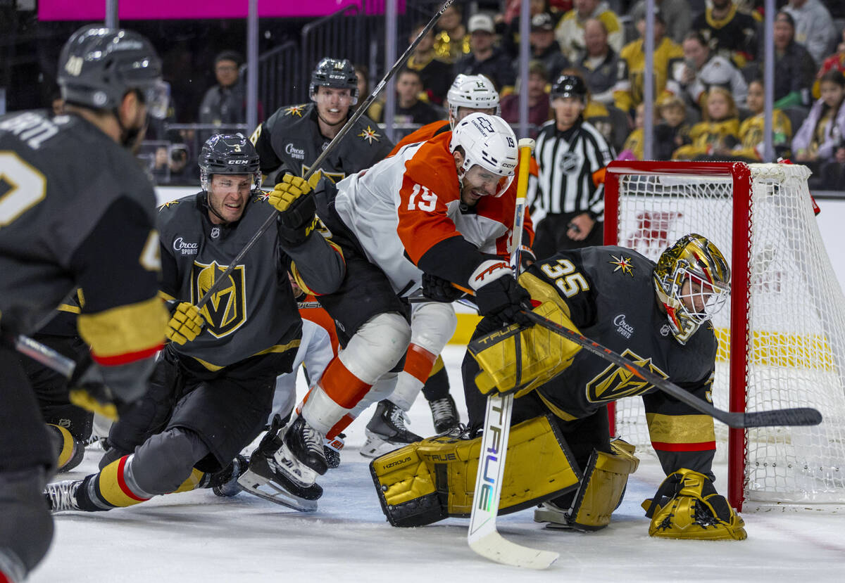 Golden Knights goaltender Ilya Samsonov (35) smothers a shot by Philadelphia Flyers right wing ...