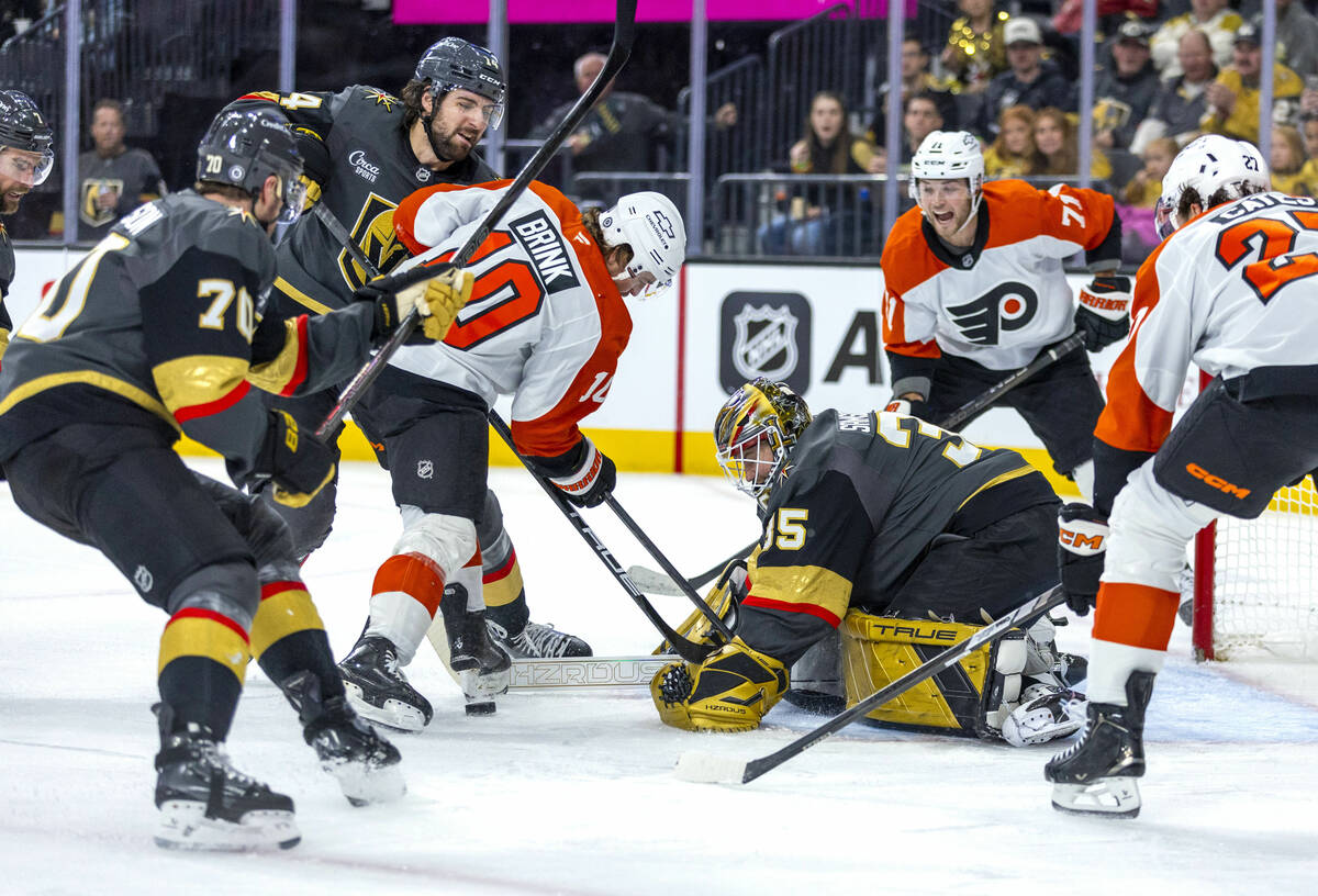 Golden Knights goaltender Ilya Samsonov (35) smothers a puck against Philadelphia Flyers right ...