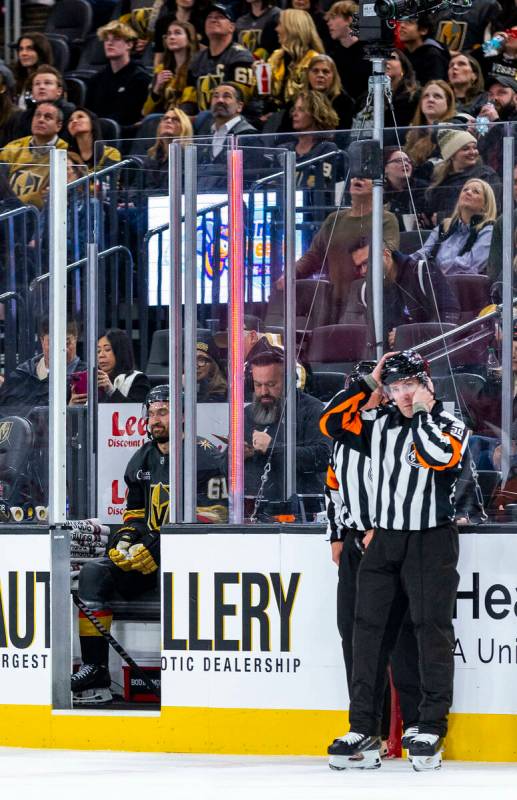 Golden Knights right wing Mark Stone (61) sits in the penalty box as officials get straightened ...