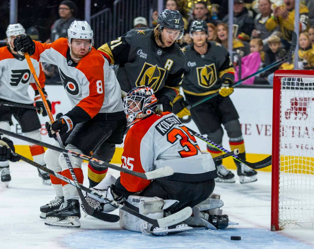 Golden Knights center William Karlsson (71) looks to a deflected shot near the net behind d Phi ...