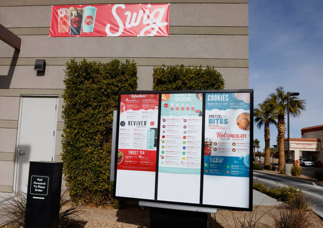 Menus are posted at the drive-thru of Swig, a Utah-based soda chain, at 1160 E Silverado Ranch ...