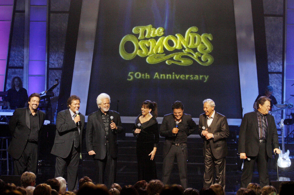 The Osmonds from left, Jay, Jimmy, Merrill, Marie, Donny, Wayne, and Alan perform during a tapi ...