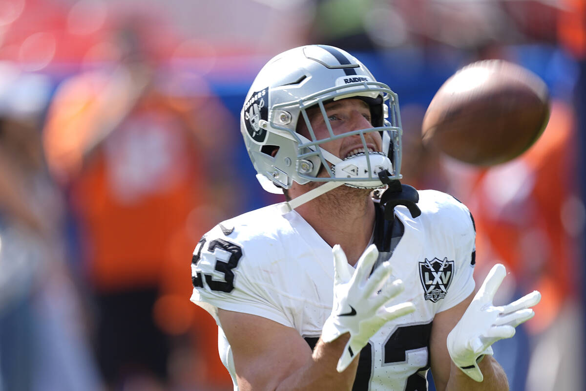 Las Vegas Raiders running back Dylan Laube catches during pregame of an NFL football game again ...