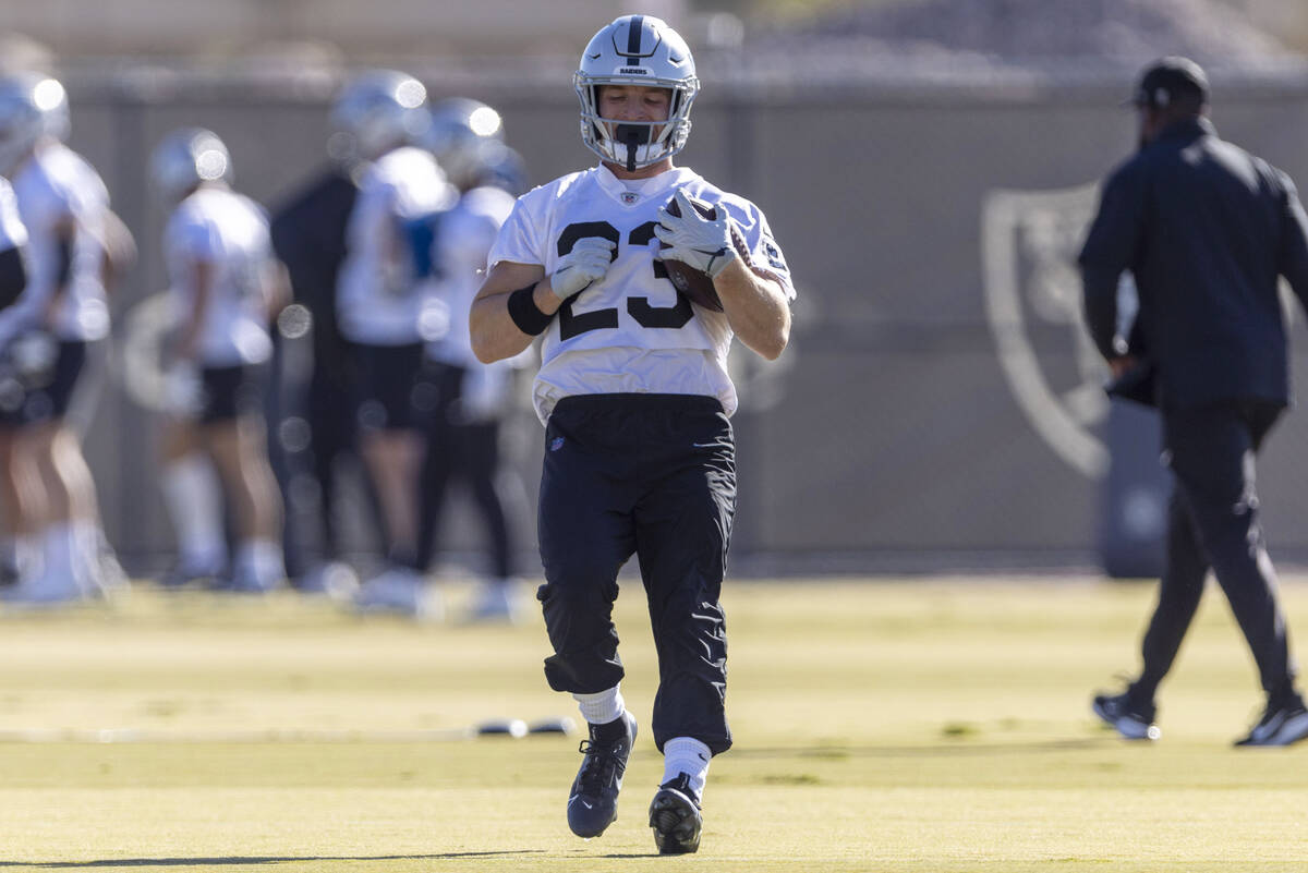 Raiders running back Dylan Laube (23) rushes with the football during the team’s practic ...