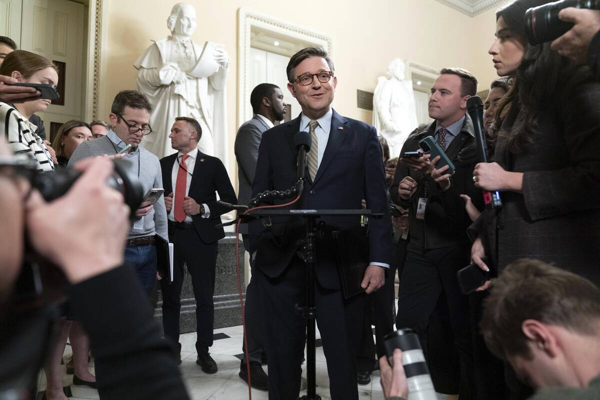 Speaker of the House Mike Johnson, R-La., talks to reporters after the House approved a funding ...