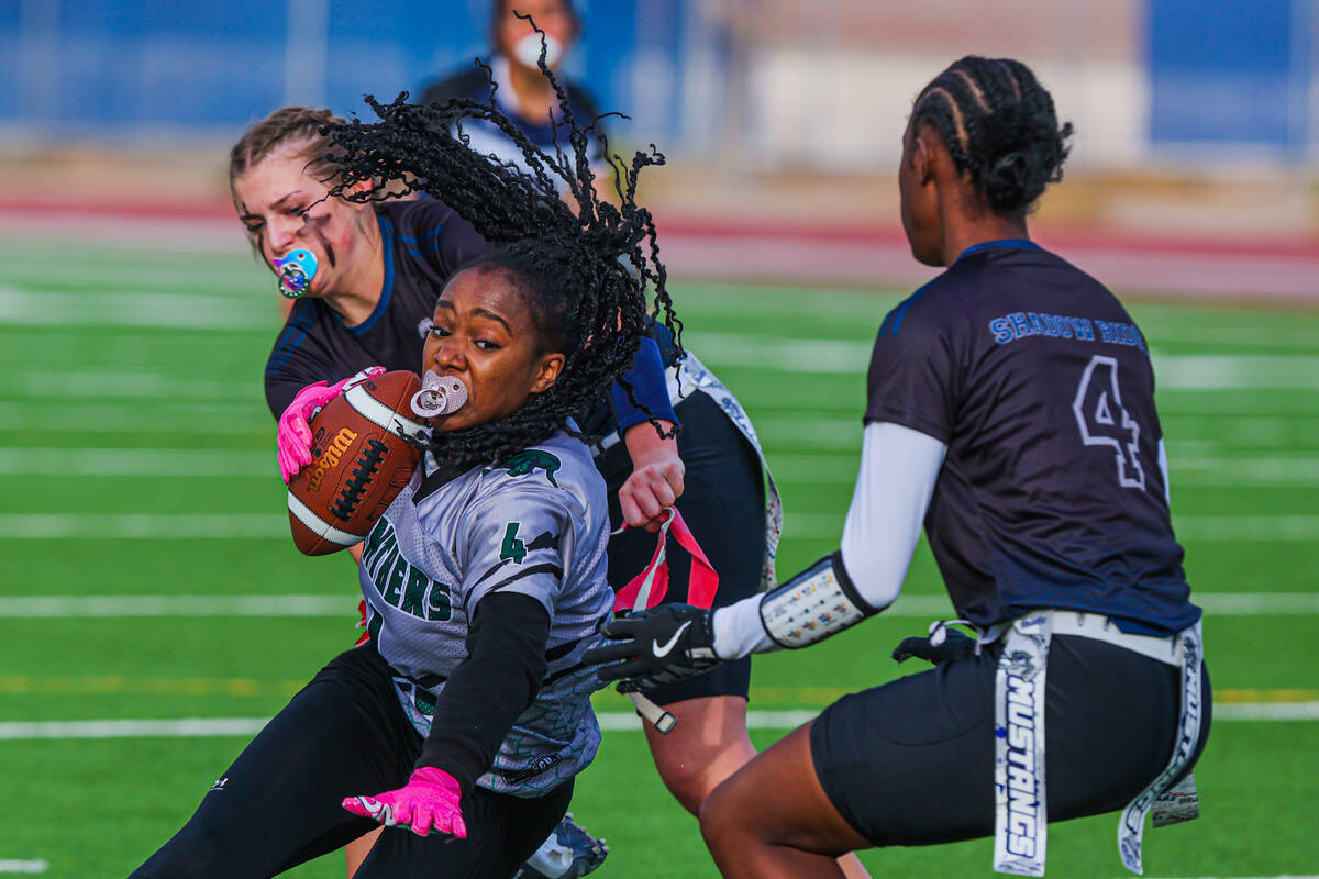 Palo Verde wide receiver Layla Roberts (4) reaches for a yard line as she falls with the ball d ...