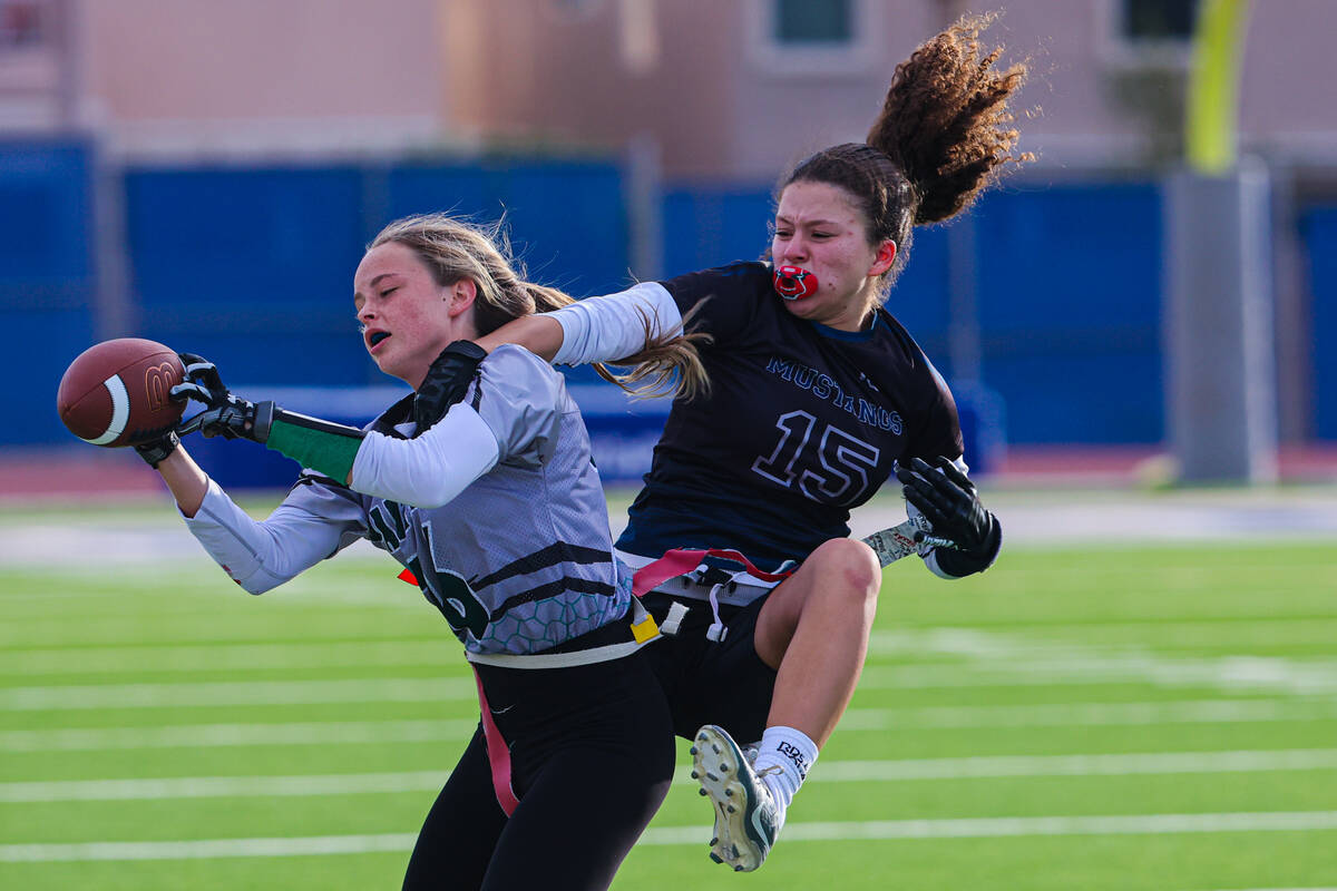 Shadow Ridge linebacker Mariah Stevens-Walden (15) forces a Palo Verde player to lose her grip ...