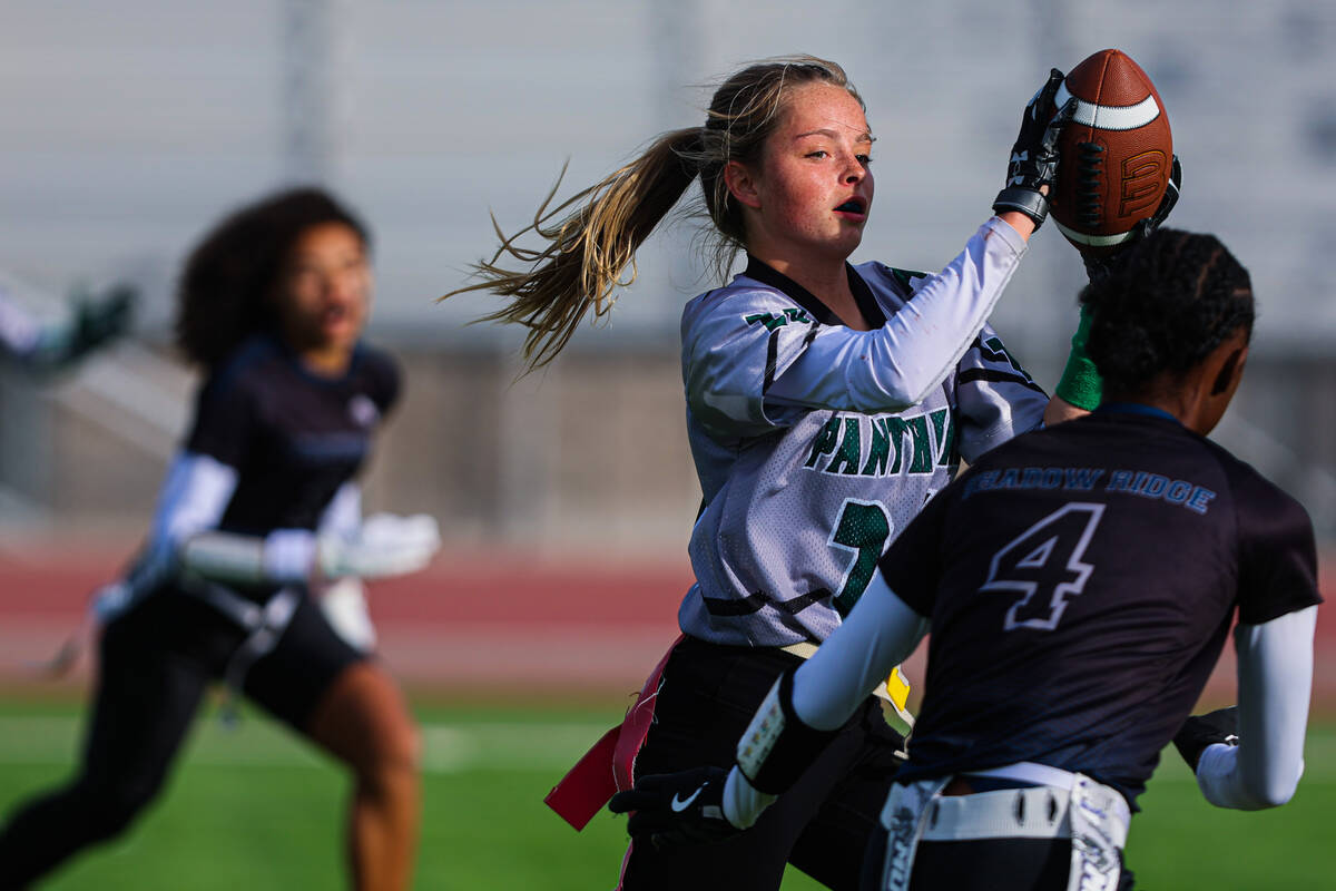 A Palo Verde player rushes the ball past Shadow Ridge defense during a flag football game betwe ...