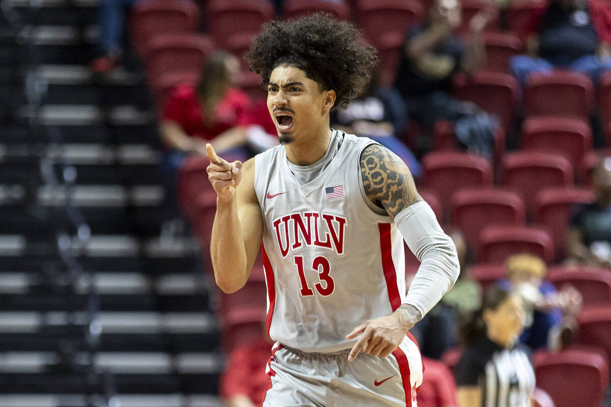 UNLV guard Brooklyn Hicks (13) cheers and points toward his team bench during the second half o ...