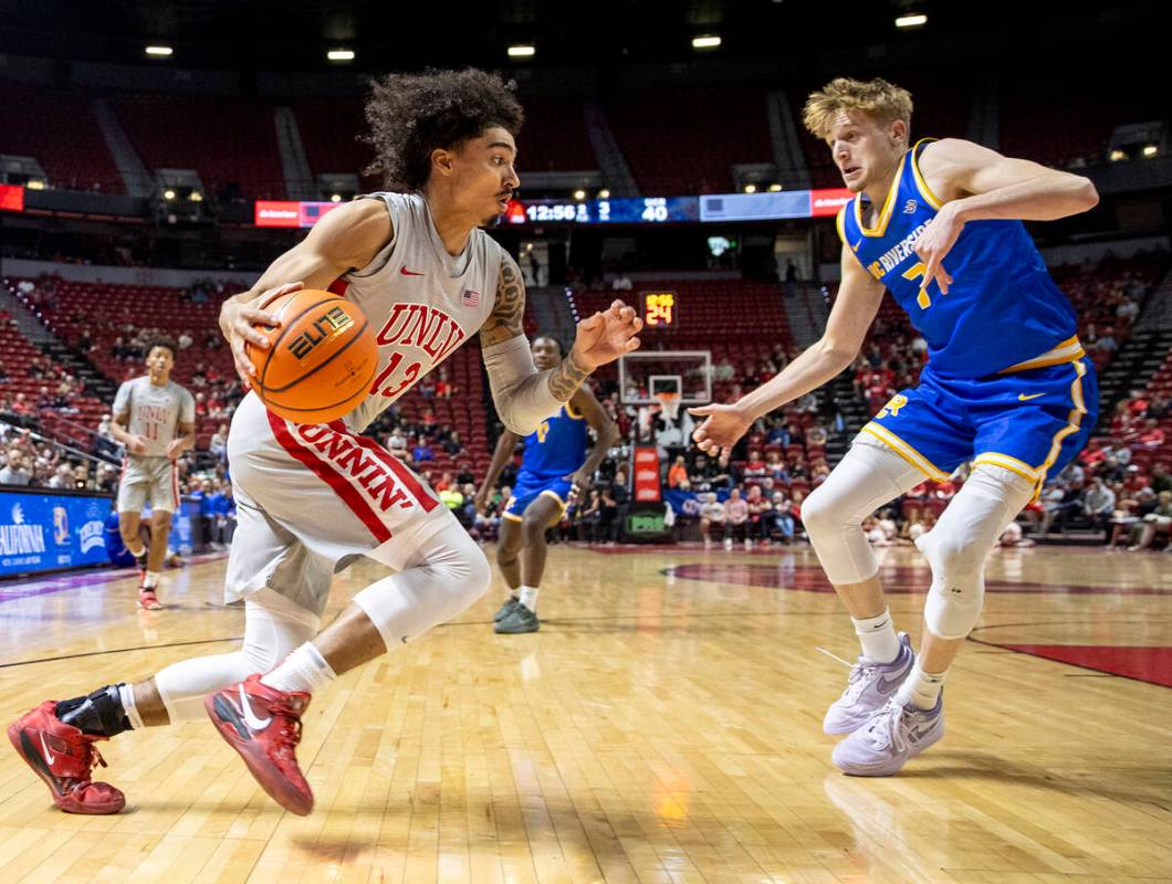 UNLV guard Brooklyn Hicks (13) attempts to pass UC Riverside Highlanders guard Parker Strauss ( ...