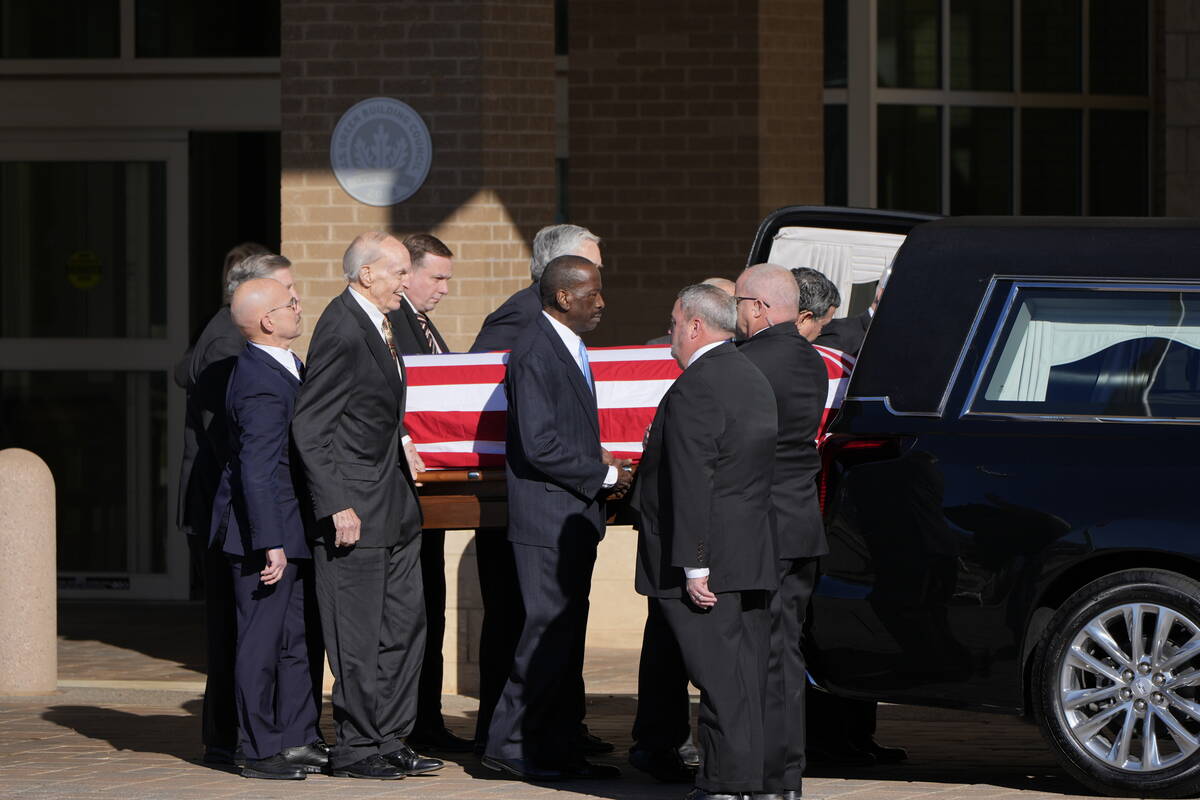 Former and current U.S. Secret Service agents assigned to the Carter detail, move the flag-drap ...