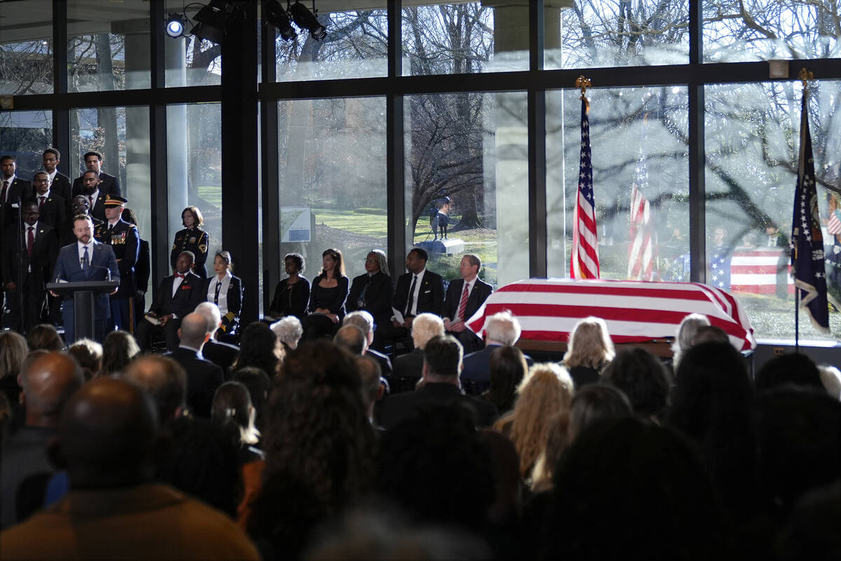 Jason Carter, grandson of former President Jimmy Carter, speaks as the flag-draped casket of fo ...