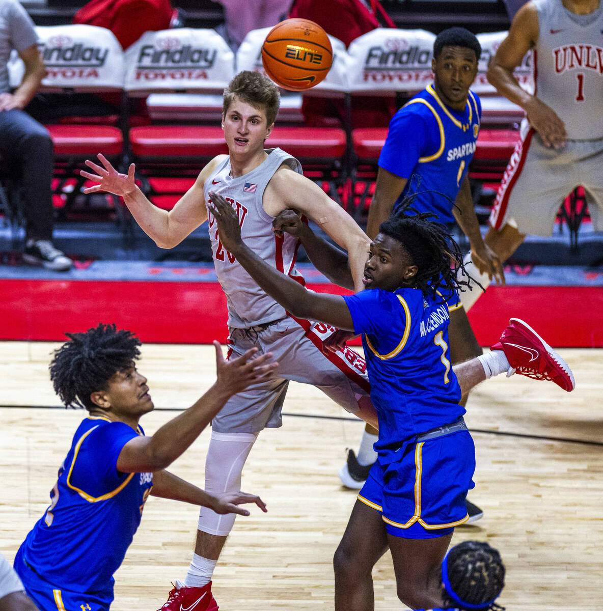 UNLV guard Julian Rishwain (20) looks after his pass over San Jose State Spartans guard Will Mc ...