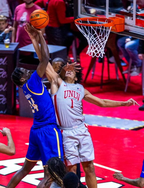 San Jose State Spartans forward Sadraque NgaNga (24) battles on the boards for a shot attempt a ...