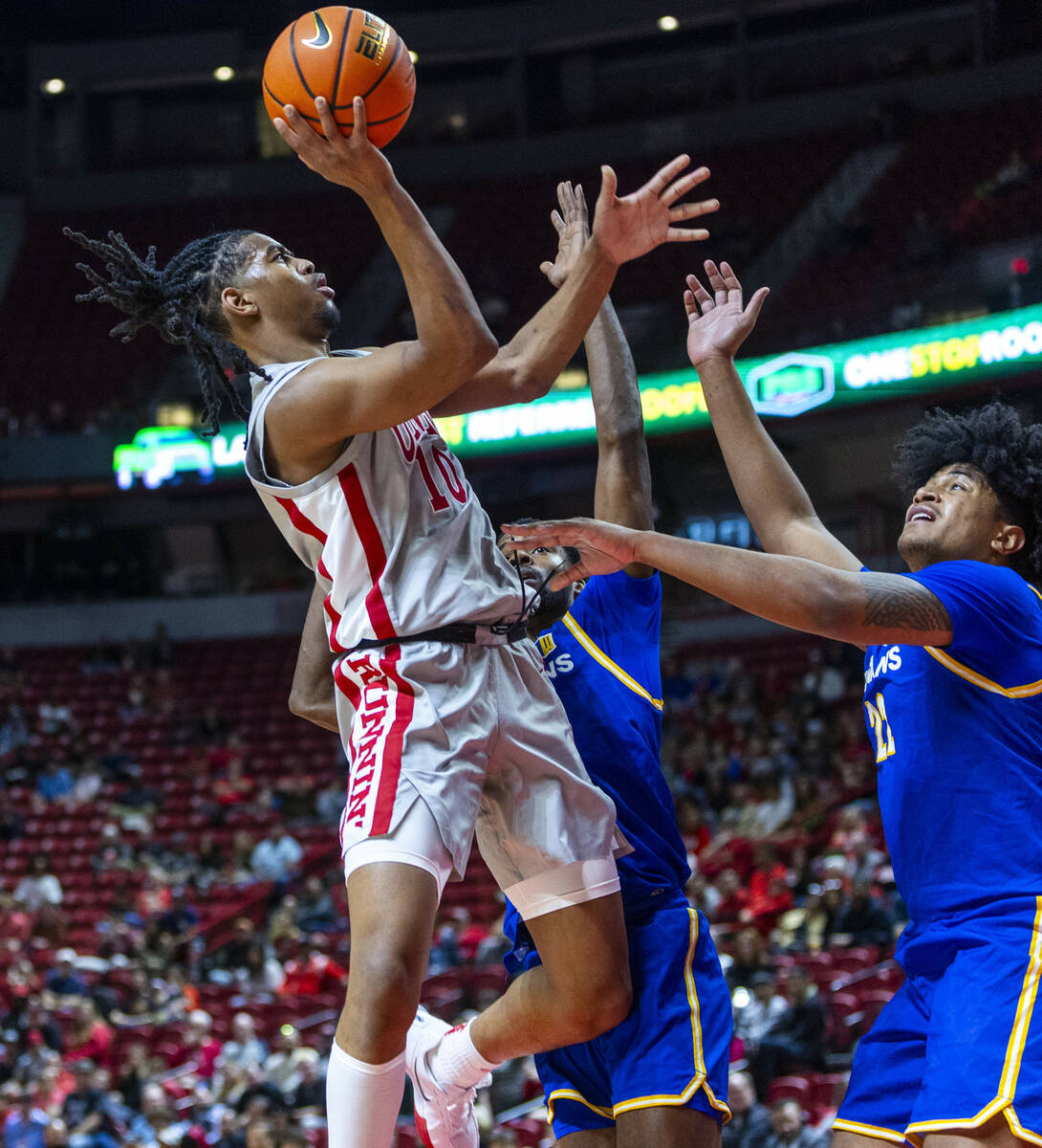 UNLV guard Jaden Henley (10) shoots over San Jose State Spartans guard Josh Uduje (9) and cente ...