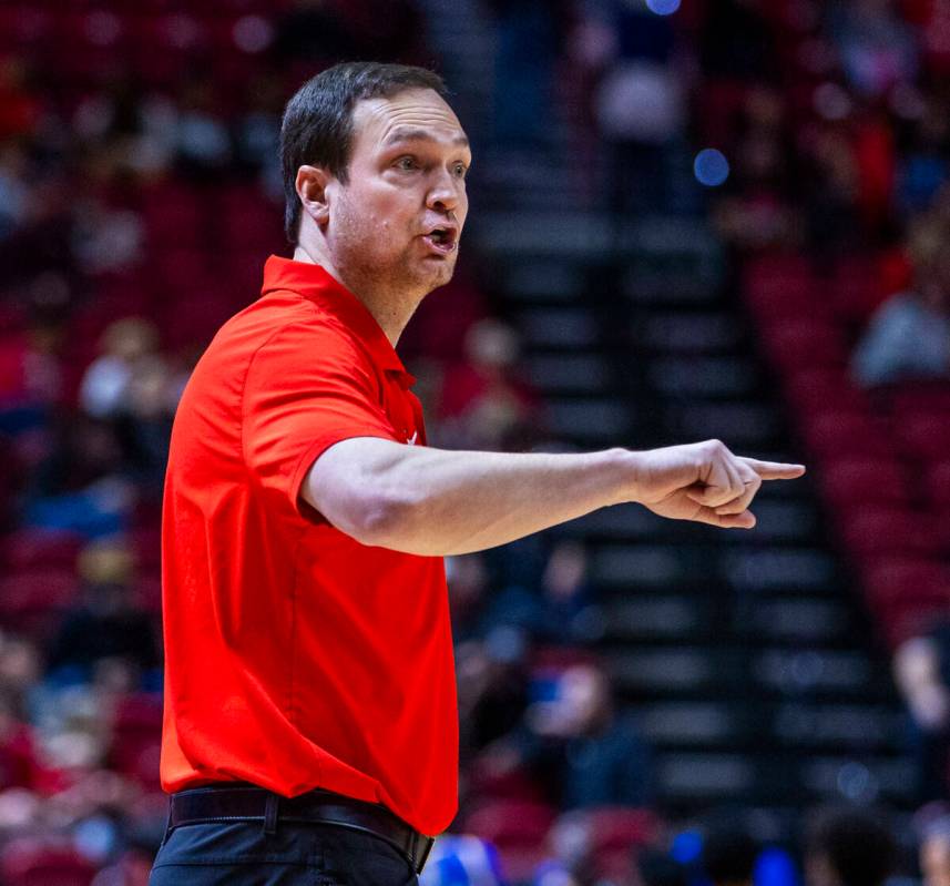 UNLV head coach Kevin Kruger counsels his players against the San Jose State Spartans during th ...