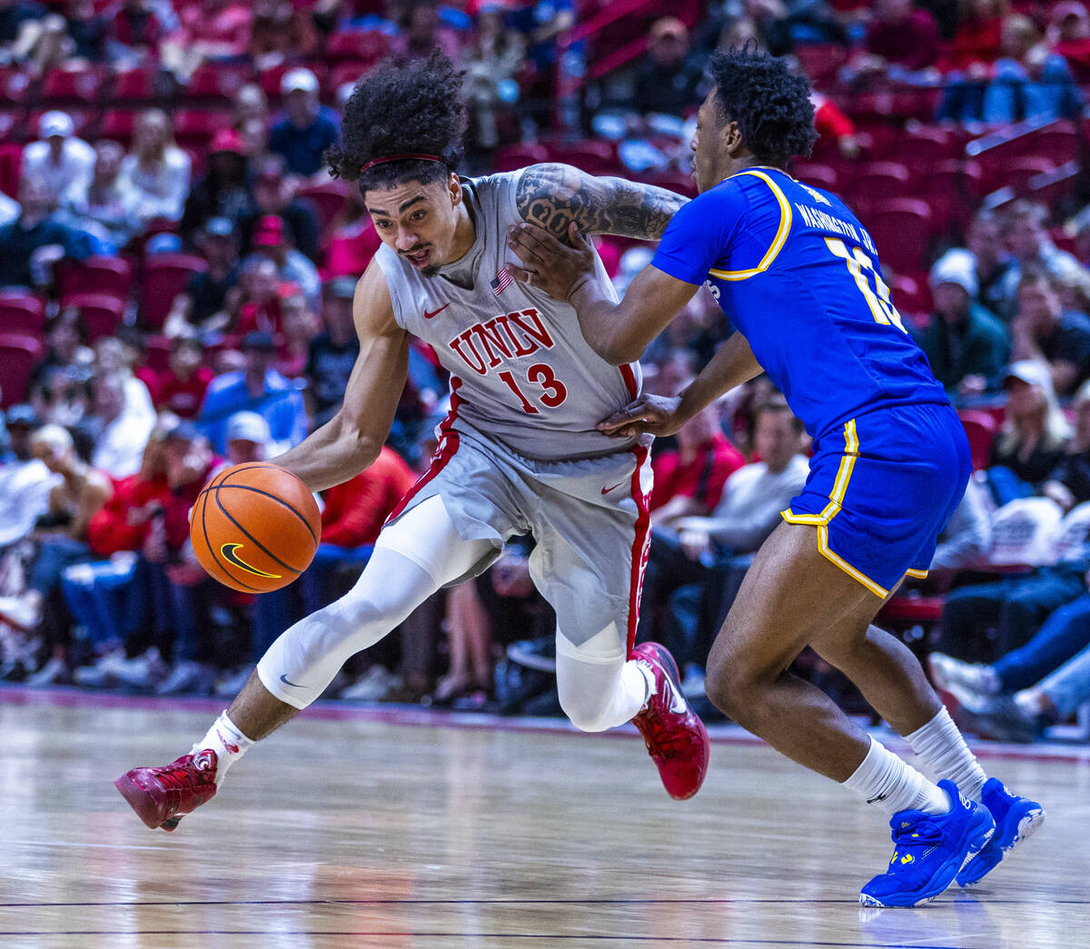 UNLV guard Brooklyn Hicks (13) battles for the lane against San Jose State Spartans guard Jerma ...