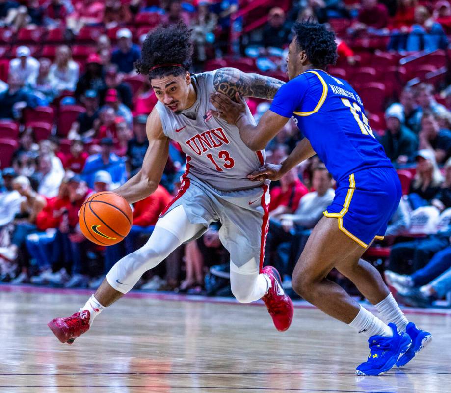 UNLV guard Brooklyn Hicks (13) battles for the lane against San Jose State Spartans guard Jerma ...