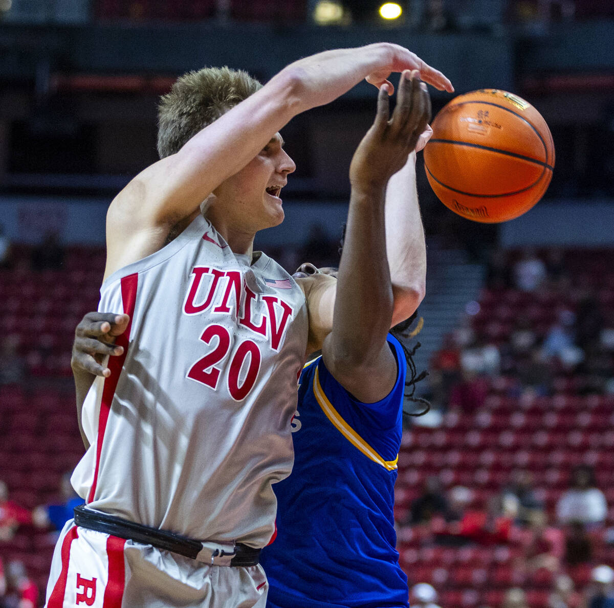 UNLV guard Julian Rishwain (20) gets off a pass while fouled by San Jose State Spartans guard W ...