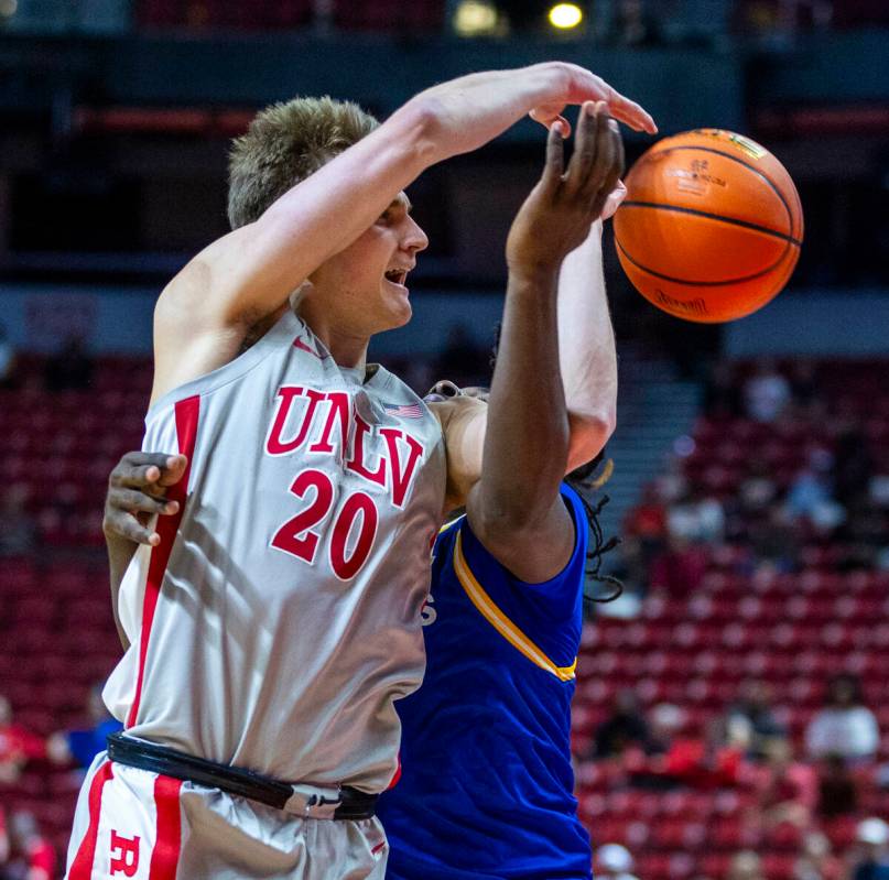 UNLV guard Julian Rishwain (20) gets off a pass while fouled by San Jose State Spartans guard W ...