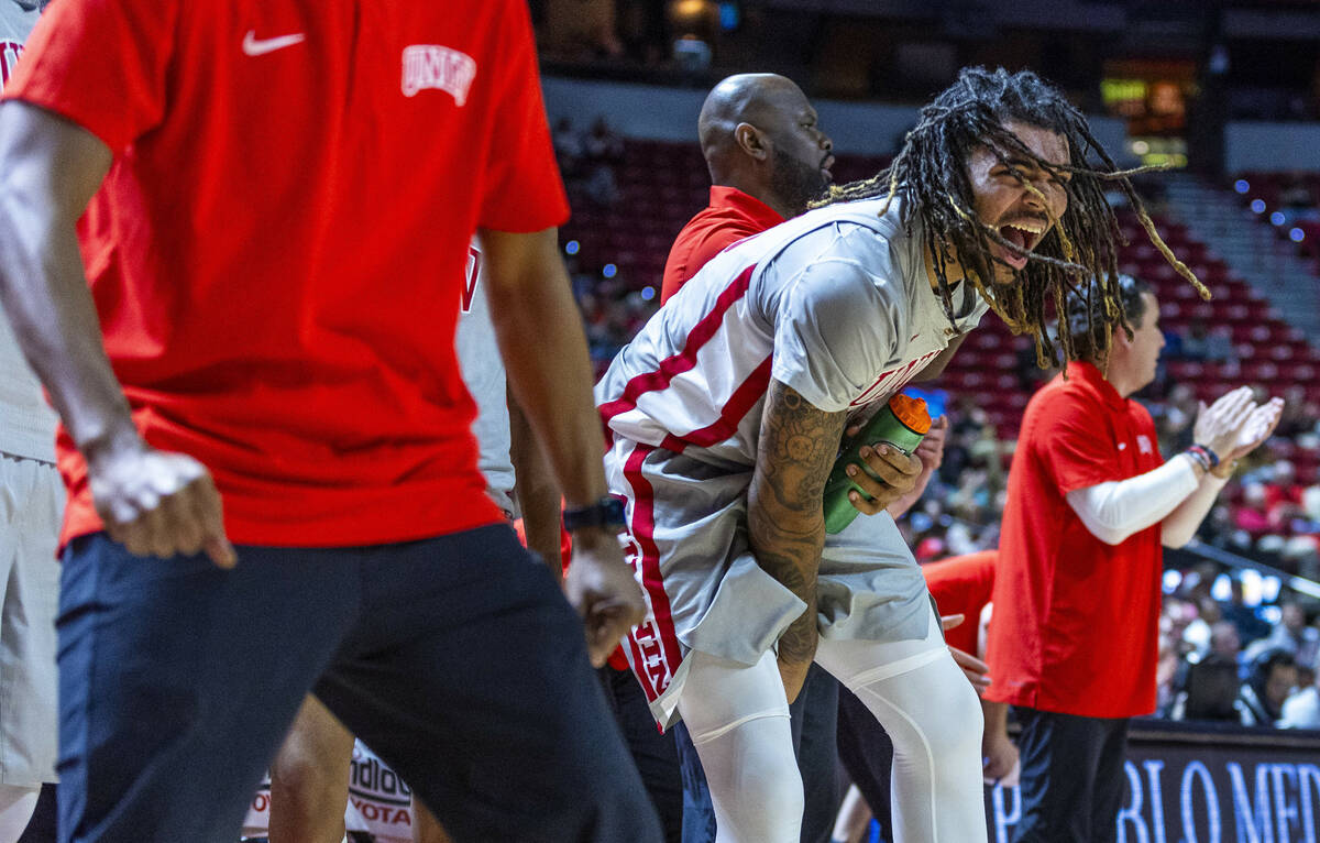 UNLV forward Jeremiah "Bear" Cherry (45) is pumped up on the bench as they solidify t ...