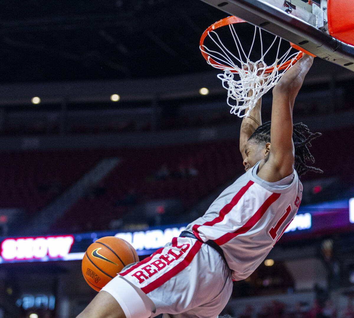 UNLV guard Jaden Henley (10) dunks the ball off of a pass against the San Jose State Spartans d ...