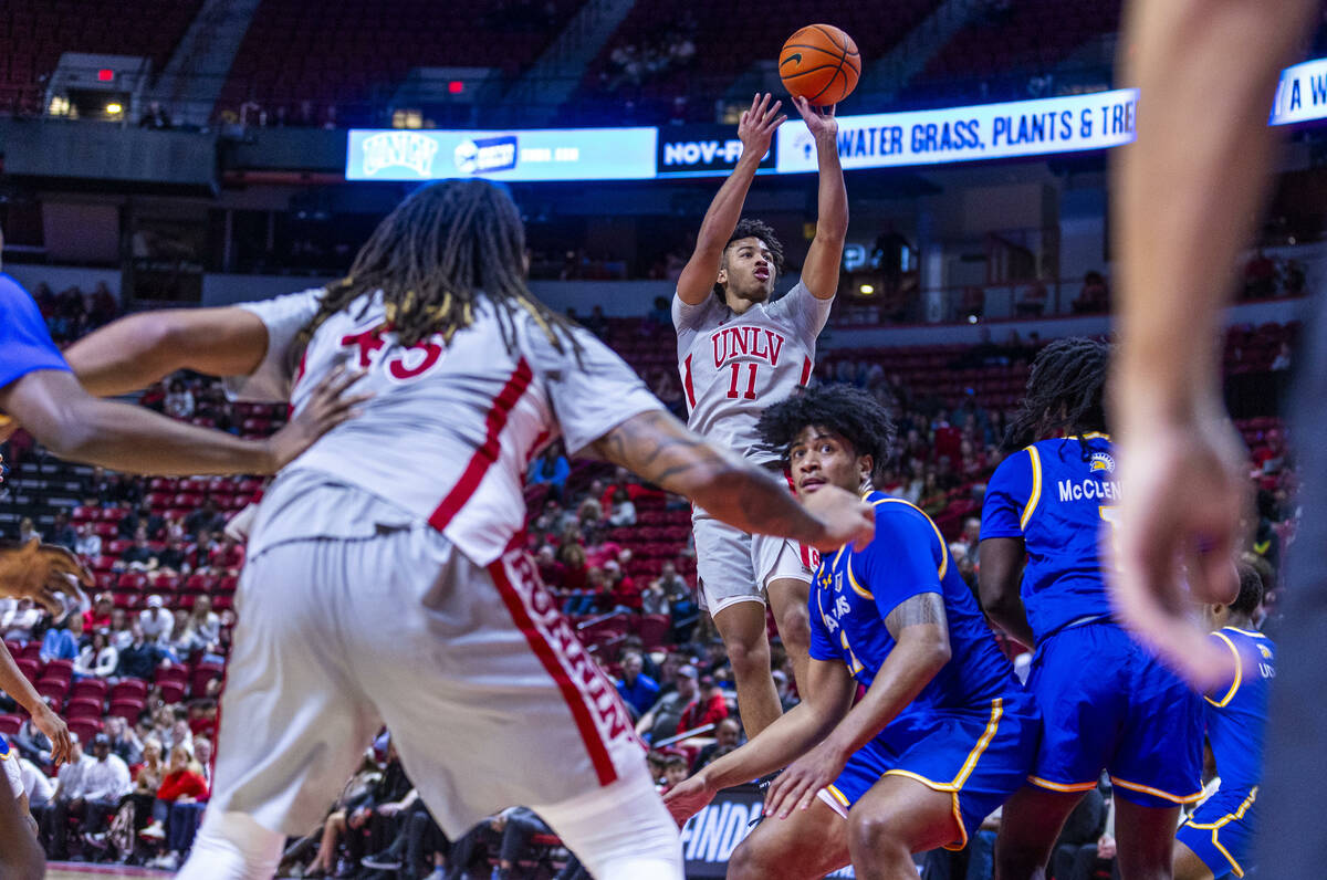 UNLV guard Dedan Thomas Jr. (11) makes critical score late against the San Jose State Spartans ...